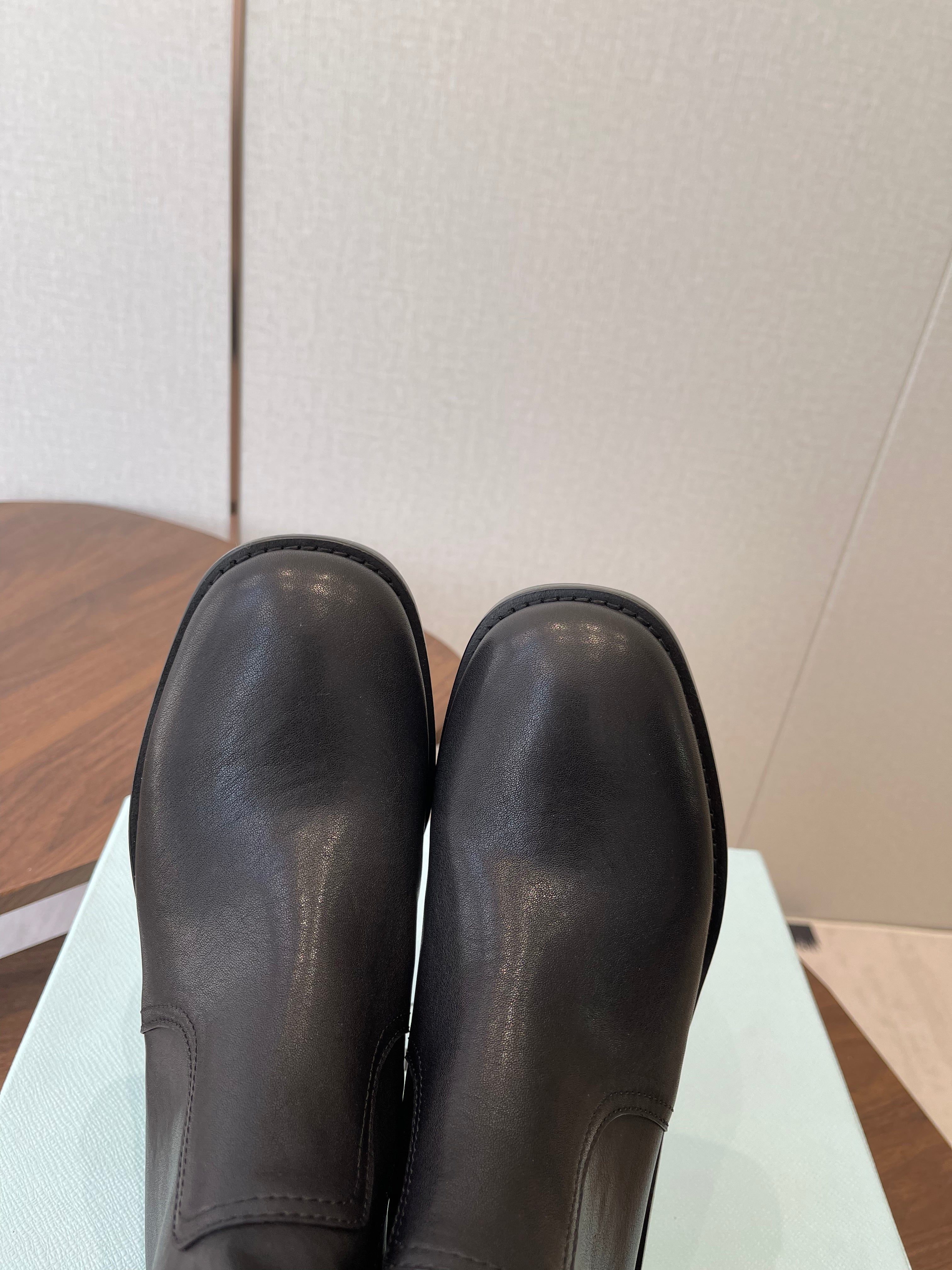 PRADA 25S COWBOY BOOTS IN RK BLACK-BROWN CALFSKIN