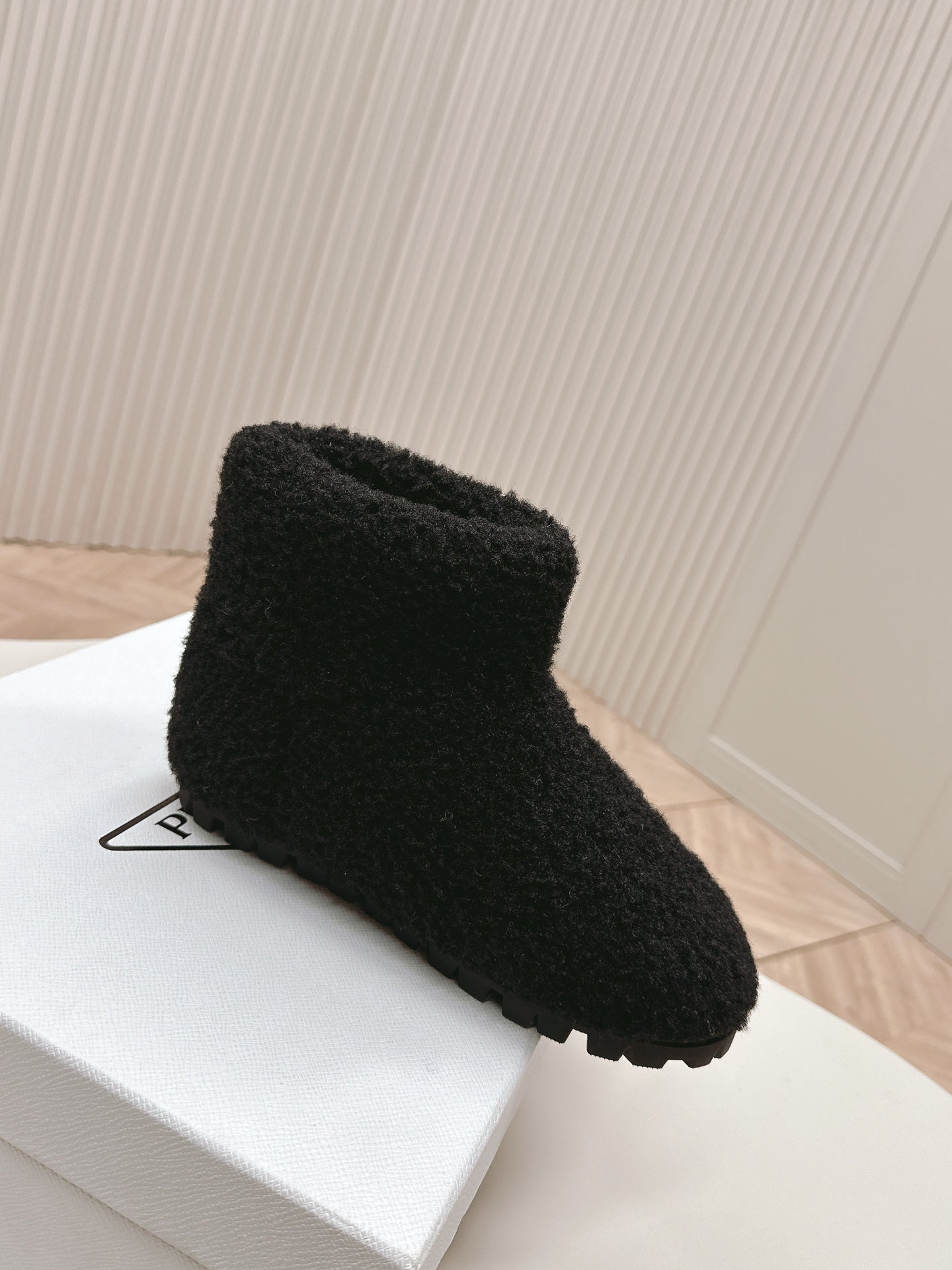 PRADA SNOW ANKLE BOOTS IN BLACK SHEARLING
