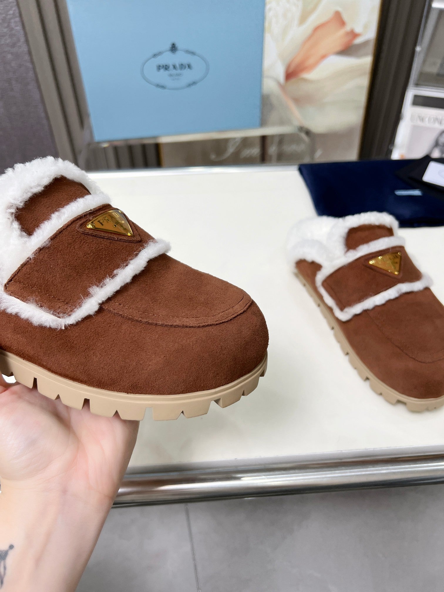 PRADA SUEDE AND SHEARLING MULES UMBER BROWN