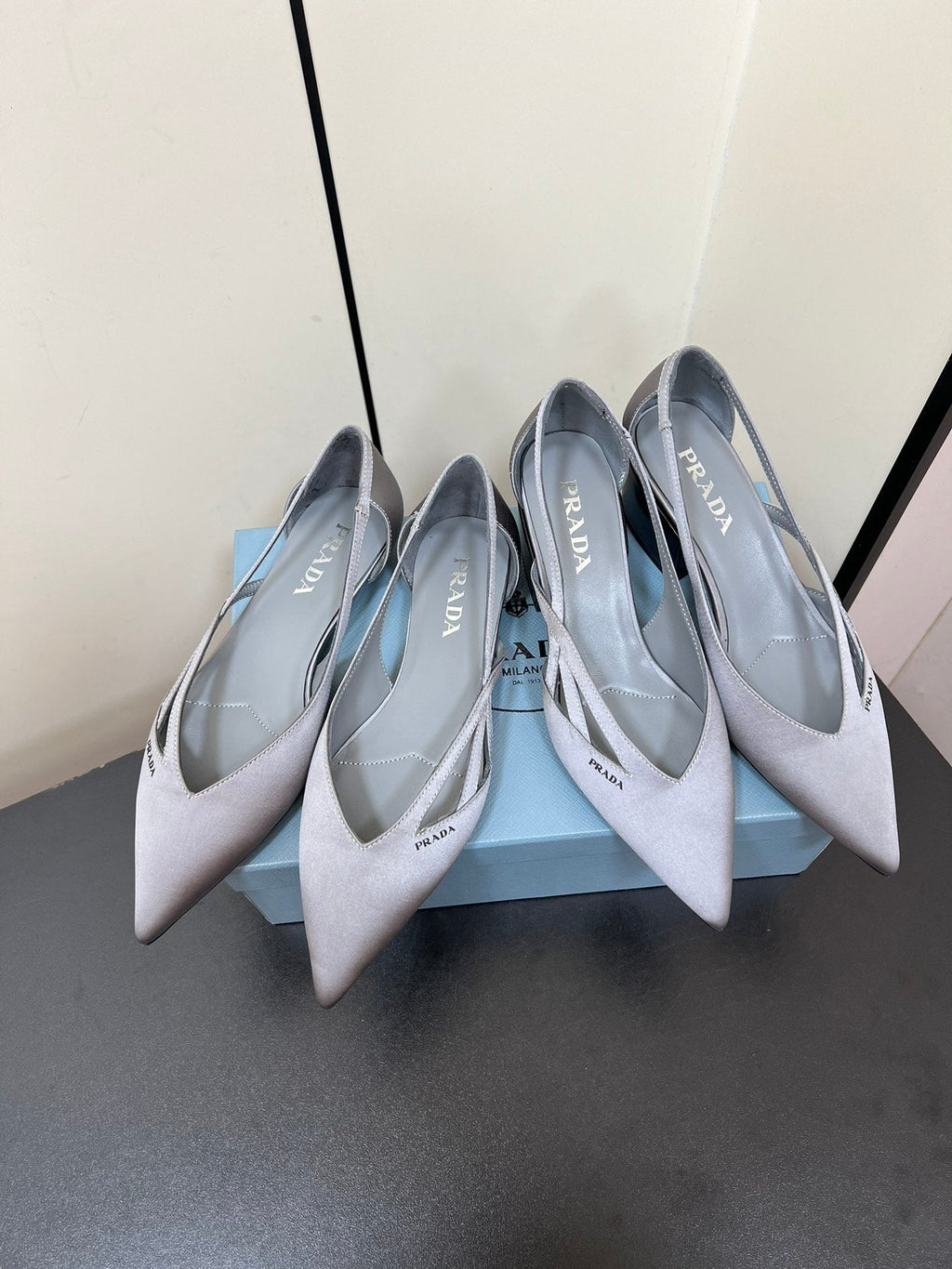 PRADA CUT-OUT BALLERINAS IN WARM GRAY SATIN