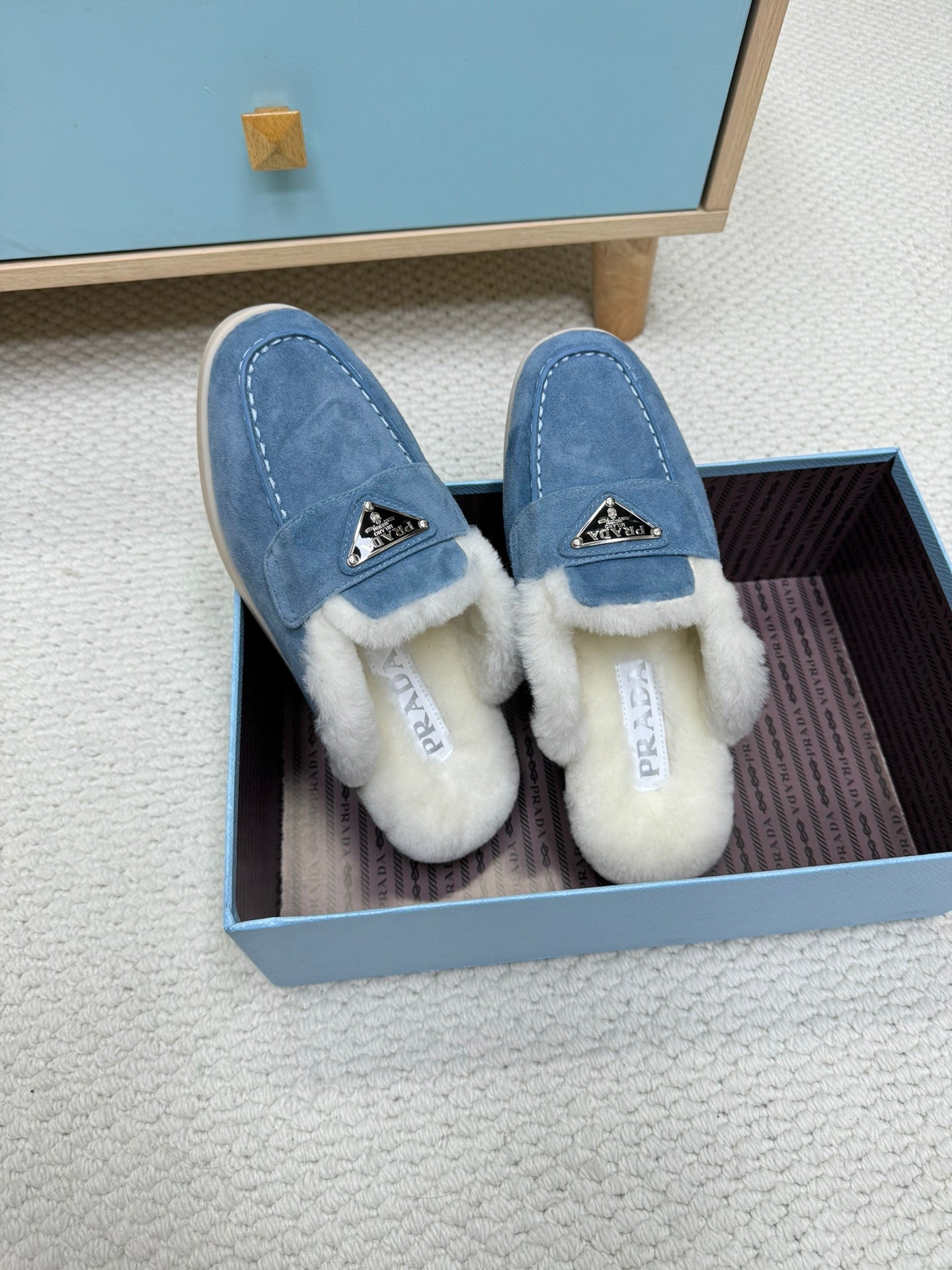 PRADA TRIANGLE LOGO FLATS IN AZURE BLUE SUEDE AND FUR LINING