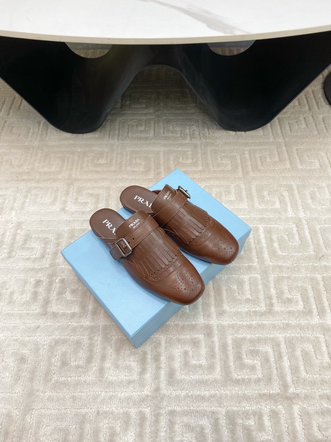PRADA TASSEL MULES IN RUSSET BROWN LAMBSKIN