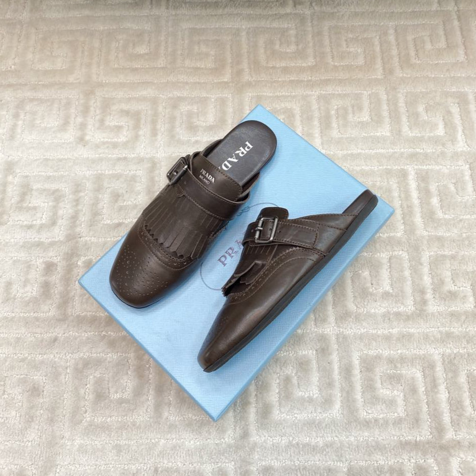 PRADA TASSEL MULES IN WALNUT BROWN LAMBSKIN