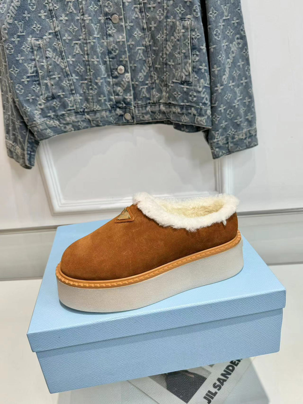 PRADA TRIANGLE LOGO MULES IN BRONZE BROWN SUEDE AND SHEARLING LINING