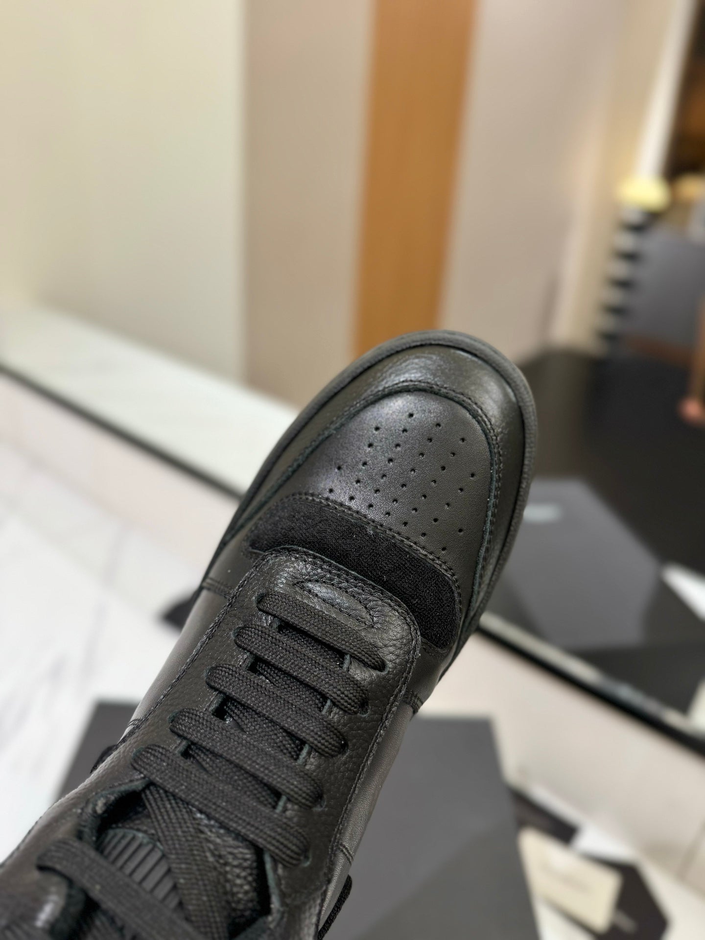MID-TOP SNEAKERS IN BLACK PERFORATED LAMBSKIN